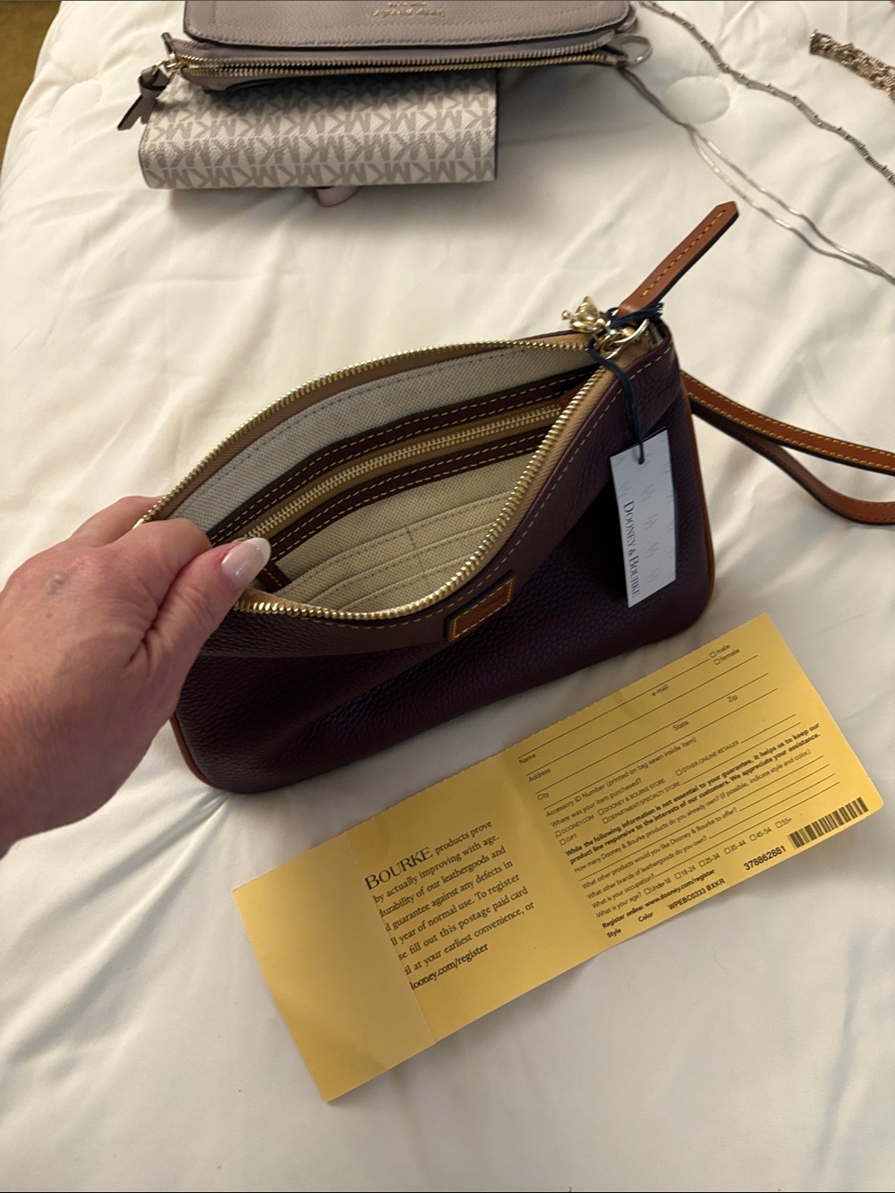Dooney & Bourke Pebbled Leather Wristlet in Deep Burgundy with Tan Strap